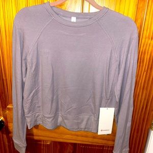 Lululemon purple crop-ish top. Nice linging on back never worn